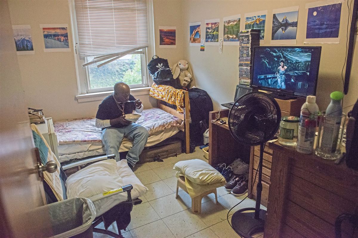 James Brown, Centre Ave. YMCA Resident eats lunch in his room